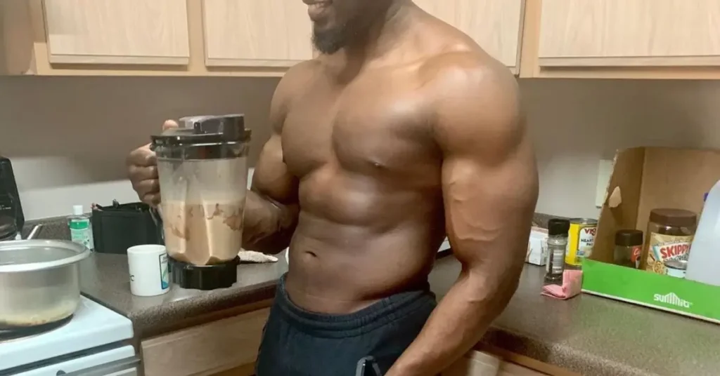 man drinking big pre workout shake