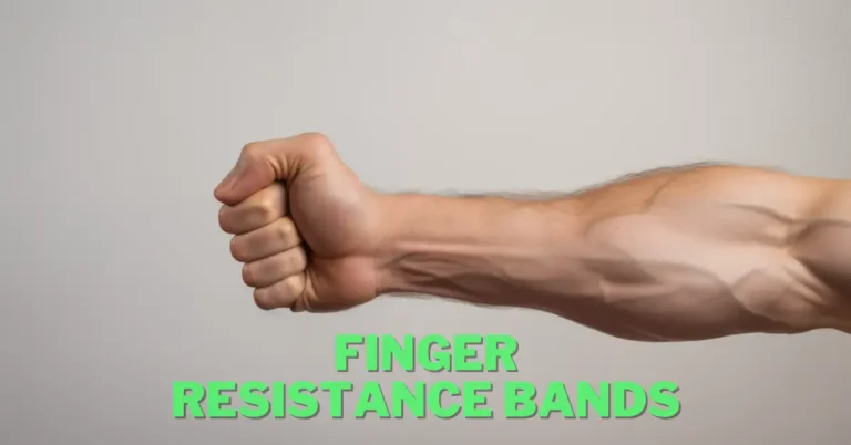 strong hand trained with finger resistance bands in front of grey wall