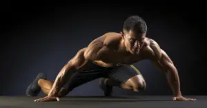 man in gym performing mountain climber exercise for full body endurance workout activation