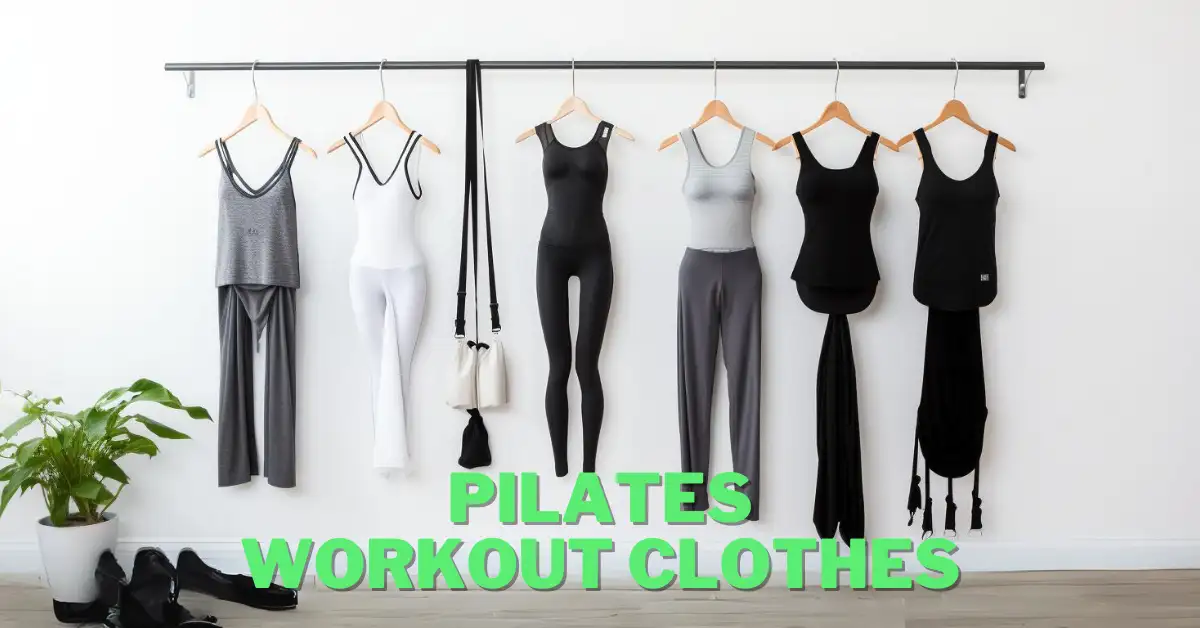 pilates workout clothes hanging in front of a white wall on a rack in smooth studio light